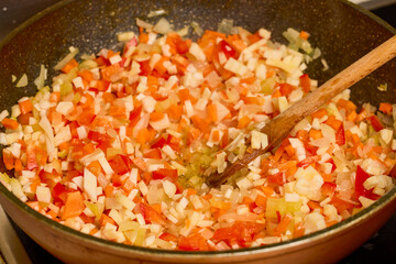 mixed vegetables cut into small cubes in a wok