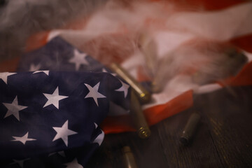 American Flag and Bullet Casings with Smoke: Patriotic Symbolism and Gun Culture Representation