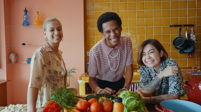 Group of friends bonding at home, LGBTQ and diversity concepts - Homosexual couple and fluid gender non binary young man with cross dressing clothing style having fun in the apartment, LGBT people