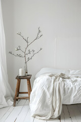 Minimalist bedroom with white bedding and a decorative branch in a serene, bright environment