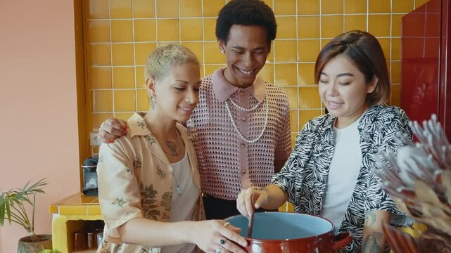 Group of friends bonding at home, LGBTQ and diversity concepts - Homosexual couple and fluid gender non binary young man with cross dressing clothing style having fun in the apartment, LGBT people