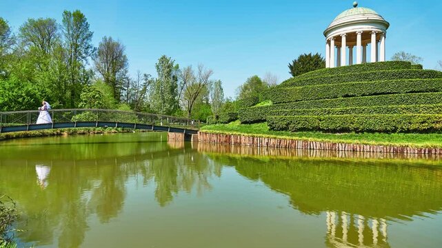 Parco Querini is green area of city of Vicenza, Italy. Monopteros is circular colonnade supporting roof but without any walls. Unlike tholos, it does not have walls making cella or room inside.