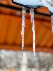 Icicle Hanging from Roof in Winter