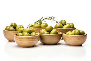 Wooden bowls with green olives isolated on a white background