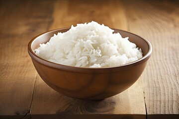 Wooden table with a bowl of white rice