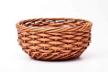 Obraz premium Woven wicker basket on white background