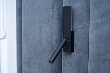 Installation of a lamp in the bed area. Electricity