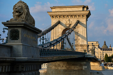 Szechenyi Chain bridge in Budapest at Sunset. Famous bridge over Danube river connecting Buda and Pest. Historical architecture in Hungary