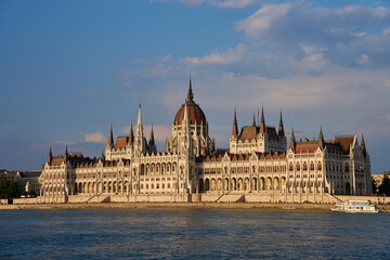 Fototapeta premium Hungarian Parliament Building in Budapest at sunset with reflection in Danube River. Neo Gothic architecture and famous landmark of Hungary