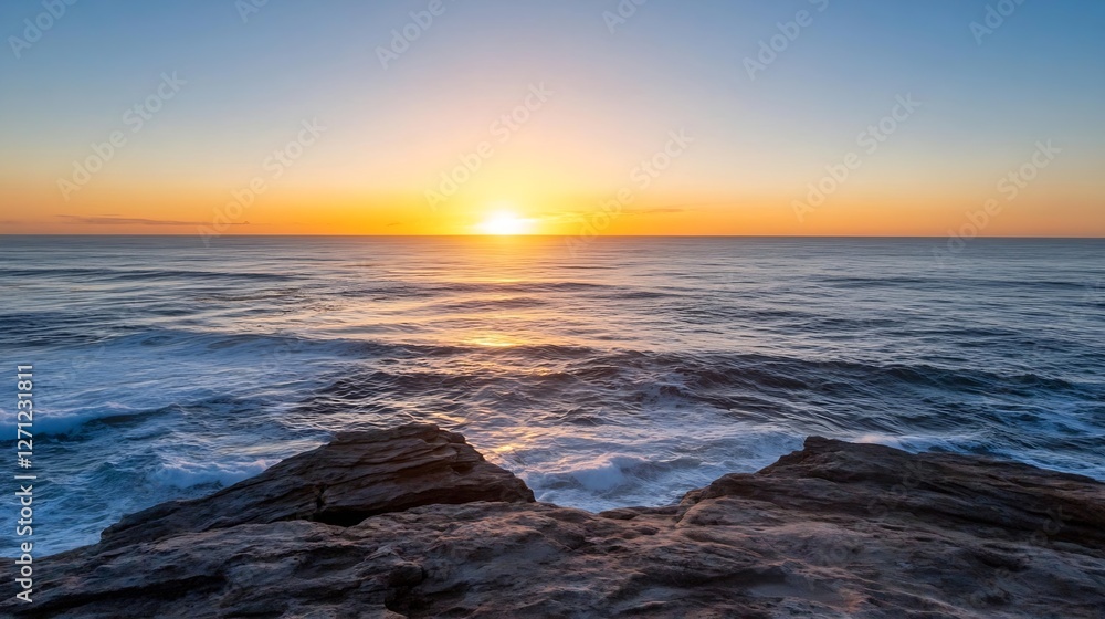 Poster breathtaking view of the sun setting over a tranquil ocean with gentle waves crashing on rocky shore