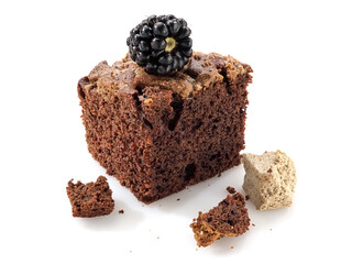 Brownie with halva piece with a blackberry on top, close up, studio shot