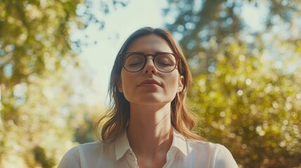 Myopia prevention with a woman wearing glasses meditating in a park. Wellness, fitness, and eye protection