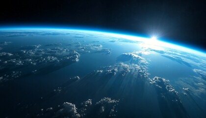 The sun rising over the horizon.