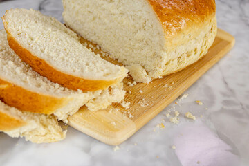 Freshly baked bread on a cutting board.
