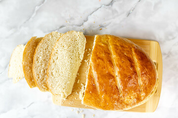 Freshly baked bread on a cutting board.