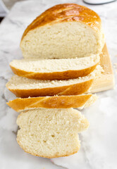 Freshly baked bread on a cutting board.