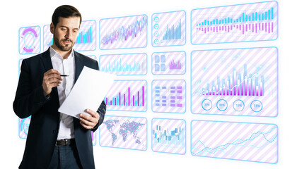 Businessman reviewing documents with futuristic financial charts on a white background. Concept of...