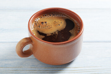 Coffee in brown cup
