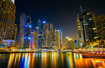 Fototapeta premium Colorful reflection on waters of Dubai Marina, UAE