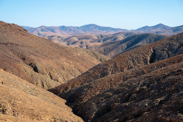 The rugged countryside of Fuerteventura with volcanic mountains.