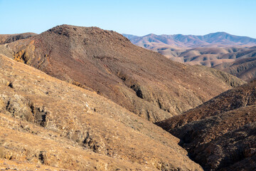 The rugged countryside of Fuerteventura with volcanic mountains.
