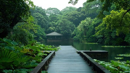 Fototapeta premium Serene Lakeside Garden Path with Wooden Bridge and Gazebo