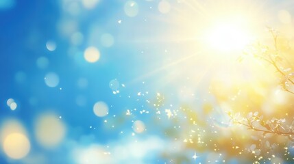 A fresh spring blue sunny sky background with blurred warm sunny glow.