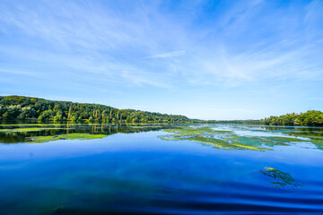 View of Lake Kemnader and the surrounding green nature in the Ruhr area. Landscape at the Ruhr reservoir near Bochum and Hattingen. Kemnader See.
