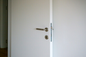Modern minimalist white interior room door with key