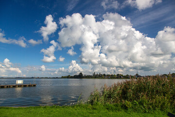 Cumulus clouds above lake Alde geaster Brekken in  Dutch province Friesland