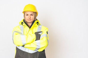 a girl in a yellow special protective jacket and a protective yellow helmet. High quality photo