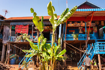 Village street in Cambodia with traditional wooden houses