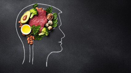 healthy food for brain functions and memory, mental wellness. Chalk drawing of brain on black...
