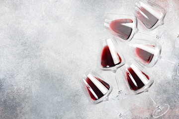 Glasses with red wine on a concrete table. Wine glasses. Top view.