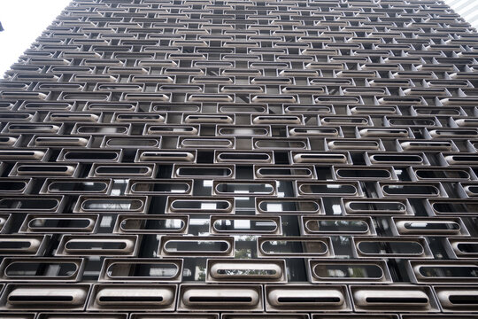 Modern Building Facade with Geometric Window Design in Hong Kong