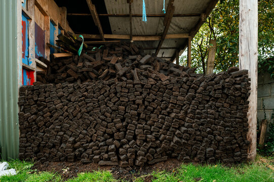Pile of Peat Bricks in Large Garden Shed