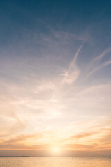 Sunset sky vertical in the evening with blue and orange sunrise on clouds fluffy in golden hour over sea, Horizon sky summer background
