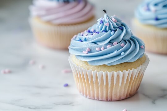 Delicious blue frosted cupcake with heart sprinkles