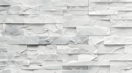 Fototapeta premium Textured white stone wall featuring layered tiles with varying patterns and shades