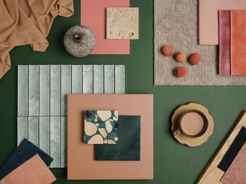  A bold and colorful material arrangement featuring green and pink tones, natural stone, and rich fabric textures for a fresh and contemporary design.