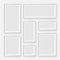 Realistic blank white picture frames collection. Modern poster mockup for artwork, photography, or advertising. Perfect for art galleries, interior decor, and branding. Vector illustration