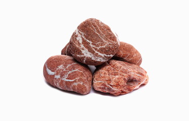 Red rocks, from the beach pile of stones isolated on a white background