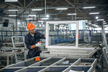 Fototapeta premium Busy at work. Man is in the modern factory