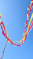 Cheerful Streamers against a Blue Sky, 8k. White tone