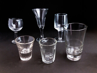 Glass goblets of different sizes, shapes and uses. The smallest goblet in the photo measures five centimeters in height.