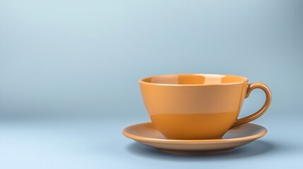 Obraz premium Warm amber teacup sits serenely on saucer against soft blue background. AI Generated