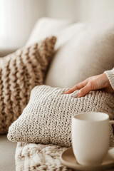 Embrace Cozy Comfort: A Warm Home Scene Featuring Plush Textures, a Relaxing Drink, and Inviting Decor for a Peaceful Lifestyle Experience
