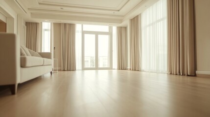 Modern living room with large windows and light colored furniture