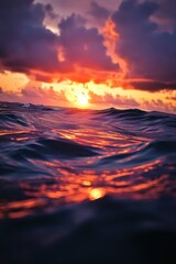 Fototapeta premium Sunset Over Ocean Waves: Beautiful Seascape with Vibrant Colors and Clouds, Perfect for Backgrounds and Travel Inspiration