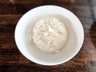 Cooked rice in ceramic bowl. Food menu concept